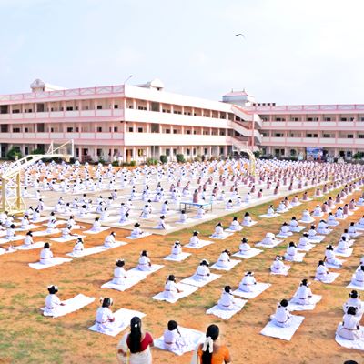 Amrita Vidyalayam students doing yoga on school ground