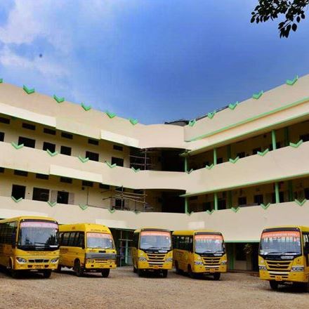 The Narayana Pillai Memorial Vidya Kendra bus ground with yellos school busses standing