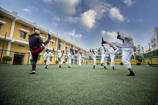 cbse schools in kanyakumari district kids doing marshal arts in school ground