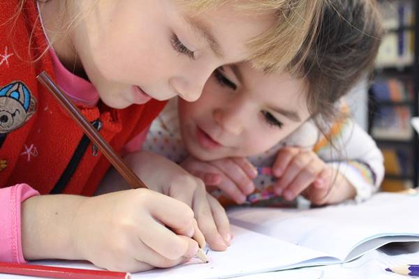 two kids studying in singapore school